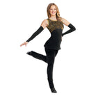 Dancer in a black and gold leotard posing on a white background