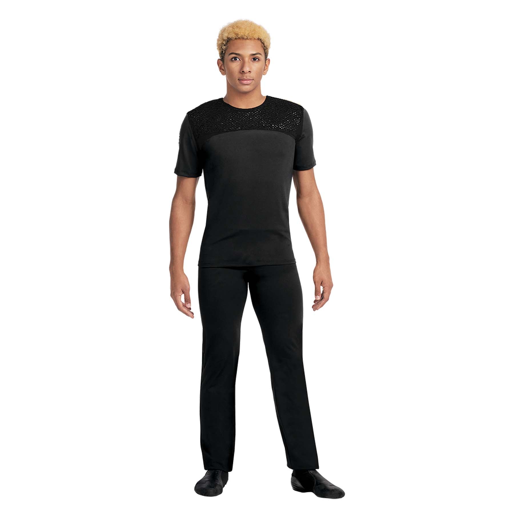 Person wearing a black outfit with embellishments on a white background