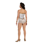 Woman wearing a white sequin leotard with gold accents on a white background