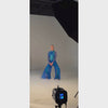 Woman wearing a blue and turquoise dance costume.