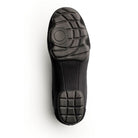 Sole view of Dinkles Accent guard shoe showing full rubber PU sole pads with sewn split‑sole pattern, circular pivot zone, and deep traction grooves for indoor/outdoor use