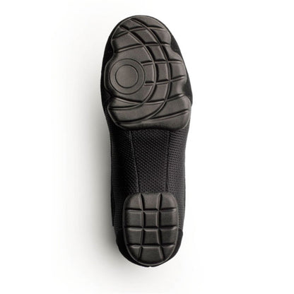 Sole view of Dinkles Accent guard shoe showing full rubber PU sole pads with sewn split‑sole pattern, circular pivot zone, and deep traction grooves for indoor/outdoor use